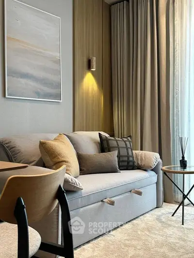 Modern living room with cozy sofa, elegant decor, and warm lighting