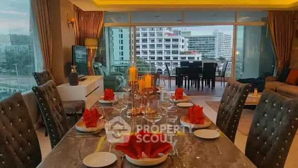 Luxurious dining and living area with elegant table setting and city view balcony.