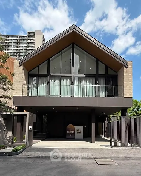 Modern architectural building with large glass windows and a sleek design, perfect for urban living.