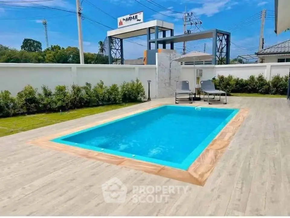 Luxurious private pool area with modern design and lush greenery, perfect for relaxation and entertainment.
