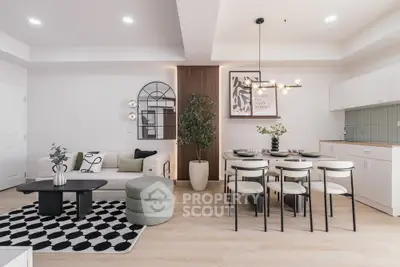 Modern open-plan living and dining area with stylish decor and natural light.