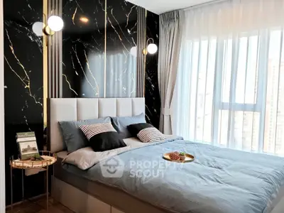 Luxurious bedroom with modern decor and large window offering city views