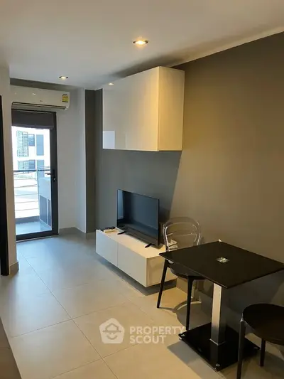 Modern apartment interior with sleek furniture and balcony view