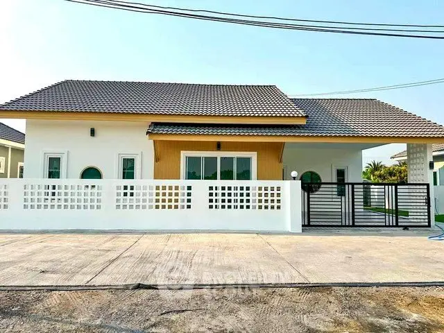 Charming single-story house with modern design and spacious driveway in a serene neighborhood.