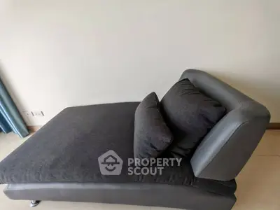 Modern gray chaise lounge in a stylish living room setting