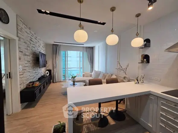 Modern open-layout living room with stylish kitchen and elegant decor