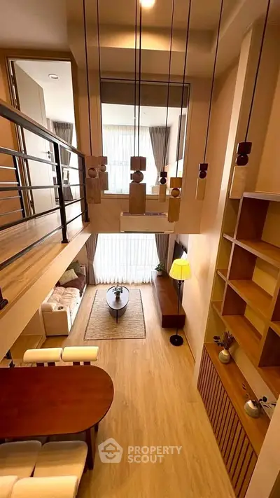 Stunning loft-style living room with high ceilings and modern decor