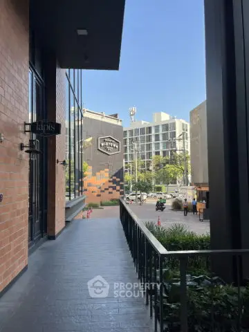 Stunning modern building exterior with spacious balcony and city view