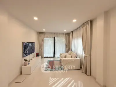 Spacious modern living room with elegant decor and natural light