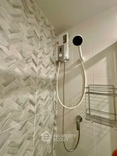 Modern bathroom shower with stylish tile design and wall-mounted showerhead