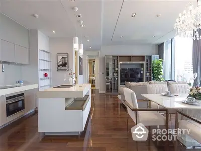 Luxurious open-plan living space with modern kitchen, high-end appliances, and elegant dining area, perfect for entertaining.