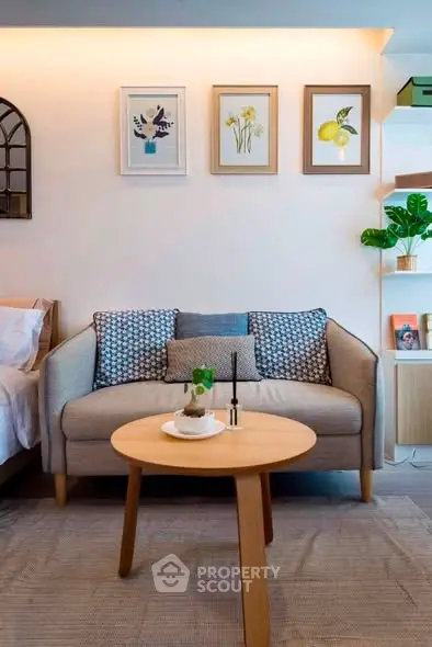 Chic living room with cozy sofa, stylish decor, and modern wooden coffee table.