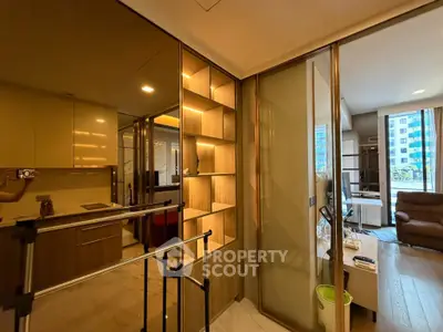 Modern apartment interior with open layout, featuring a cozy living area and stylish kitchen.