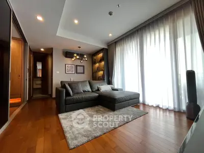 Spacious modern living room with elegant decor and large windows for natural light.