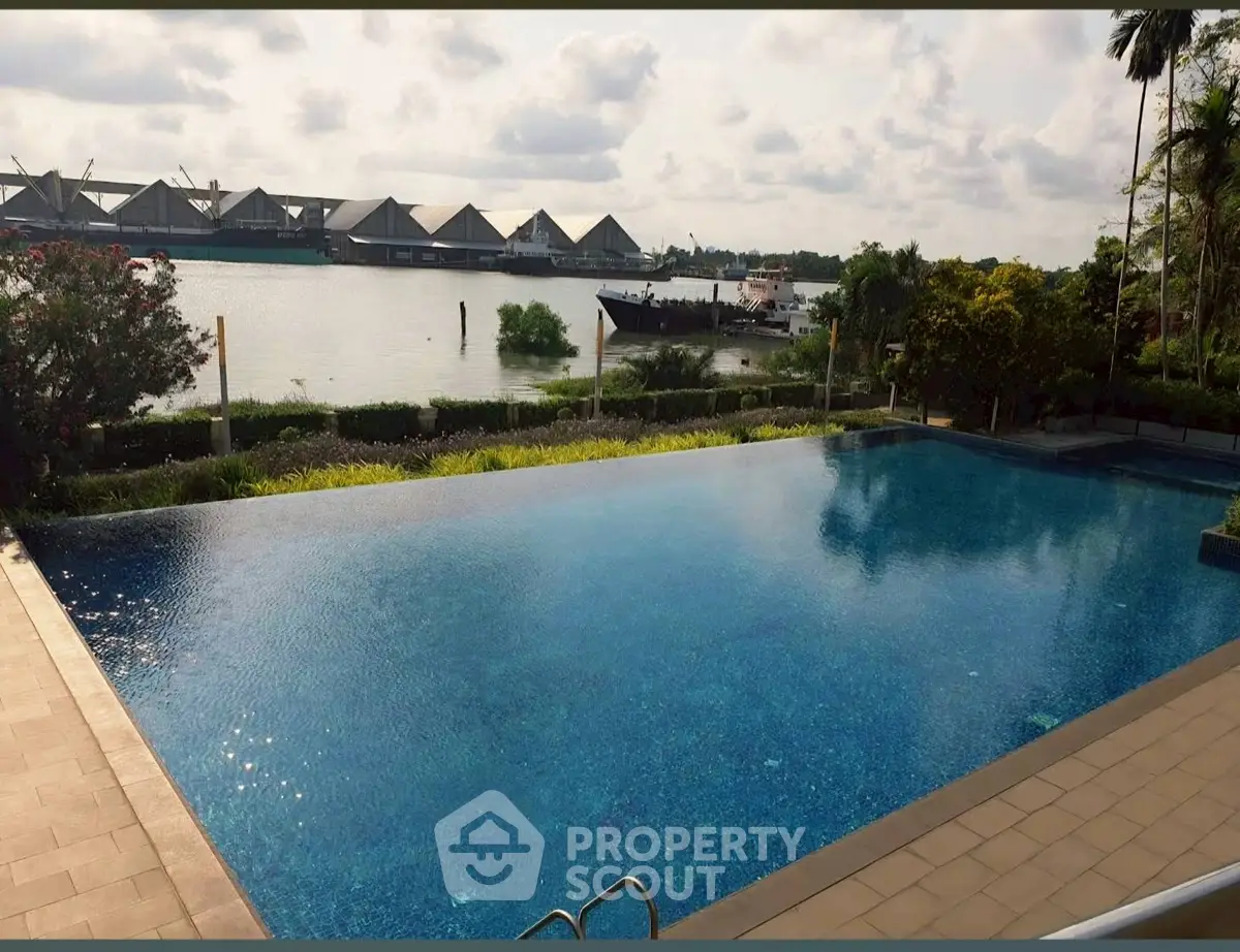 Luxurious waterfront property with stunning infinity pool and serene views.