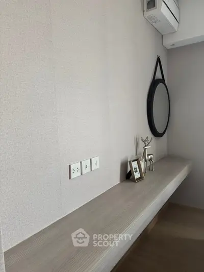 Modern minimalist study nook with wall-mounted desk and stylish decor