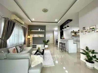 Spacious modern living room with open kitchen and stylish decor