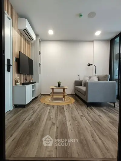 Modern living room with stylish decor and wooden flooring