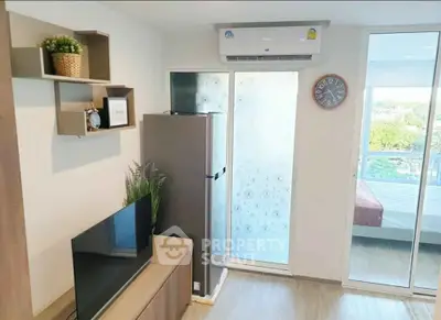 Modern living room with balcony view, featuring sleek furniture and air conditioning.