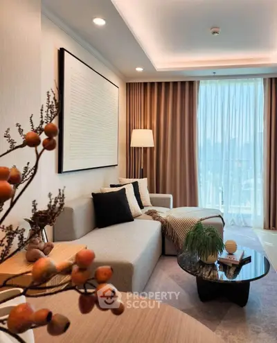 Elegant living room with modern decor and large window view