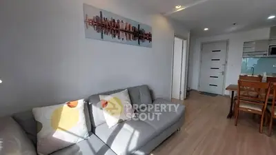 Modern living room with stylish decor and open kitchen layout