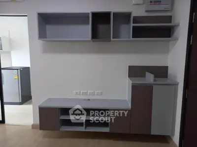 Modern living room with built-in storage and sleek design