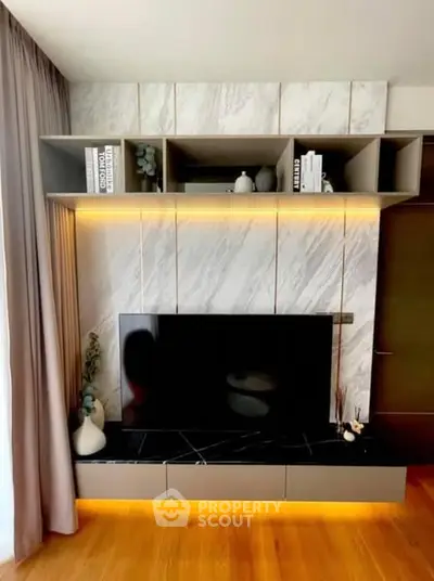 Modern living room with stylish TV unit and ambient lighting