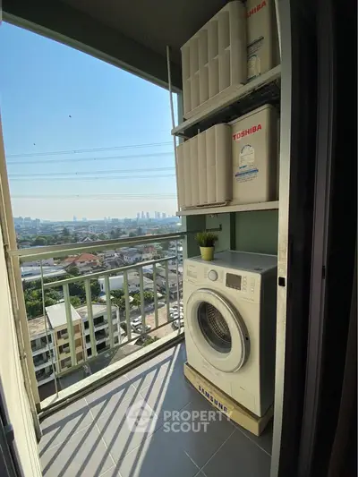 Chic balcony laundry area with washer, storage, and stunning city view.