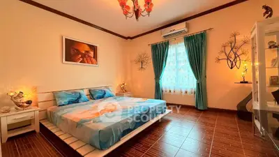 Spacious bedroom with elegant decor and natural light