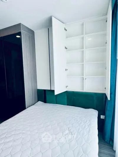 Modern bedroom with built-in storage and stylish decor