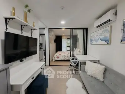 Modern studio apartment with stylish decor and open layout, featuring a cozy living area and bedroom.