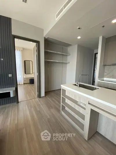Modern open-layout kitchen with sleek design and ample natural light