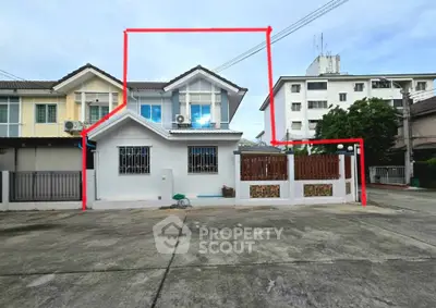 Charming townhouse with modern facade and spacious driveway in a serene neighborhood.