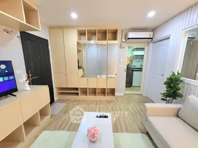 Modern living room with stylish furniture and open kitchen layout