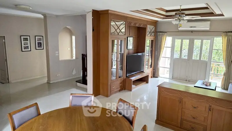 Spacious living room with elegant wooden furniture and natural light