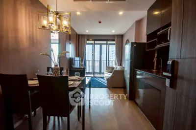 Modern open-layout kitchen and living room with stylish decor and balcony view.