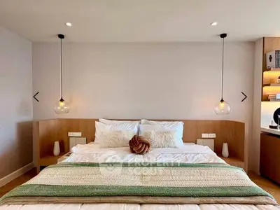 Luxurious bedroom with modern lighting and cozy decor
