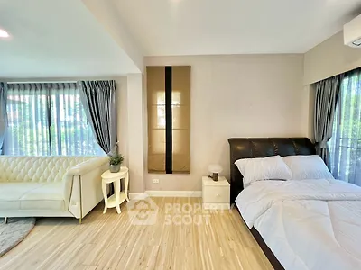Spacious modern studio with elegant decor and large windows