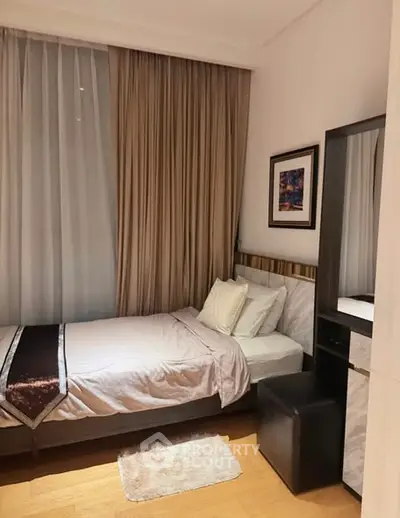 Cozy bedroom with elegant decor and soft lighting, perfect for relaxation.