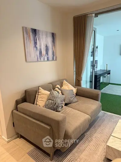 Cozy living room with modern decor and comfortable seating, perfect for relaxation.
