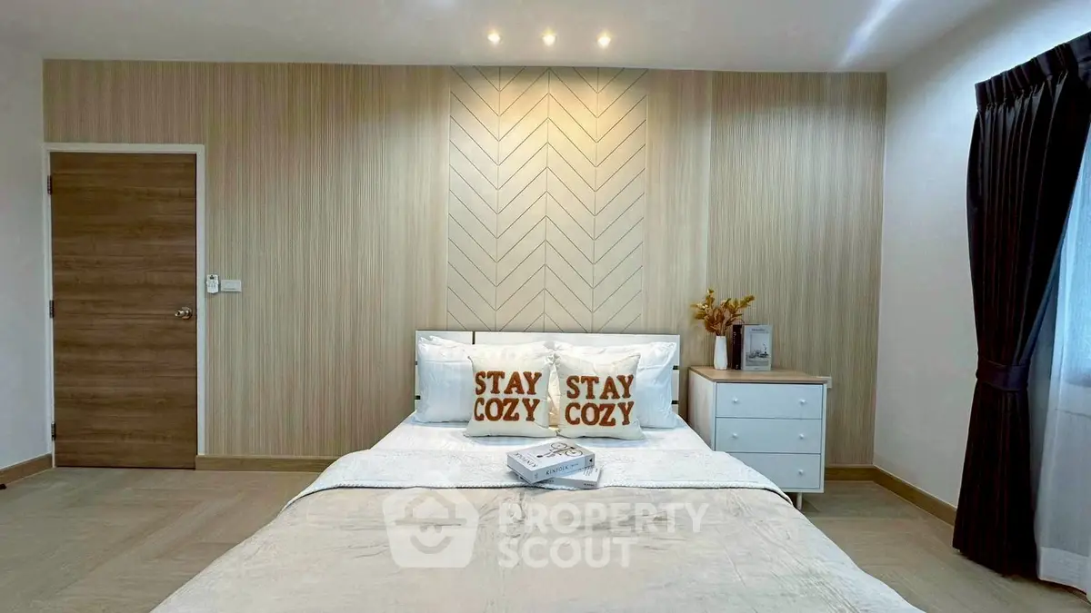 Cozy modern bedroom with stylish decor and natural light