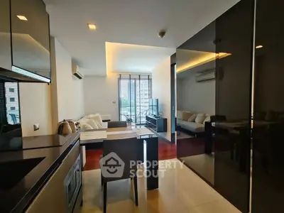 Modern living room with sleek design and city view, featuring stylish furniture and ambient lighting.