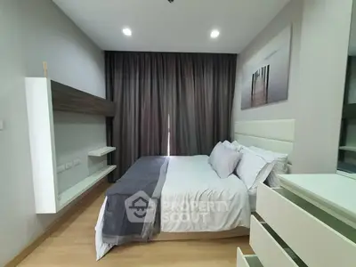 Modern bedroom with stylish decor and cozy ambiance, featuring elegant curtains and contemporary furniture.