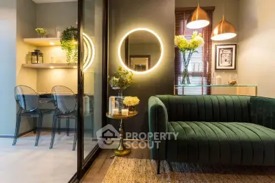 Stylish modern living room with green velvet sofa and elegant lighting