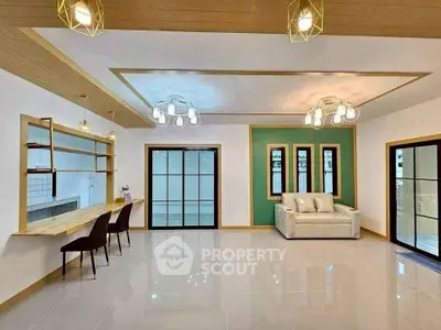 Spacious modern living room with elegant lighting and sleek design