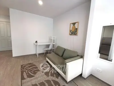 Modern living room with cozy sofa and stylish decor in a bright apartment.