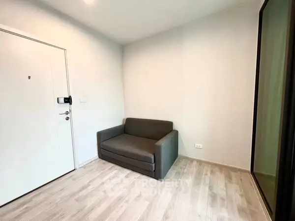 Cozy small living room with modern sofa and wooden flooring