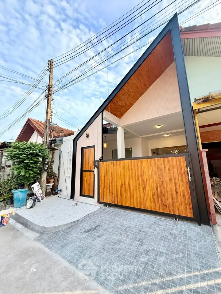 Modern angular house exterior with wooden accents and sleek design