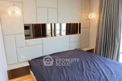 Luxurious bedroom with modern lighting and stylish wall paneling