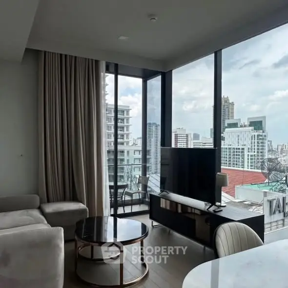Modern living room with panoramic city view and stylish furniture